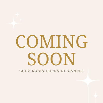 Promotional graphic with 'Coming Soon' text for a 14 oz Robin Lorraine candle on a light pink background.